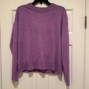 Jewel neck sweater with key hole back.